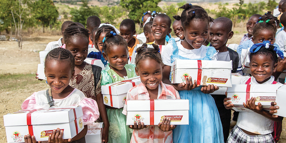 Children in Haiti recieve gifts at a Box of Joy distribution
