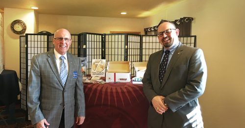 Terry Waters stands with Cross Catholic Outreach “Light on a Knight” for February 2022, Scott Nale, WV State Program Director.