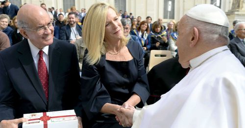 Jim Cavnar and Michele Sagarino present a Box of Joy to Pope Francis.