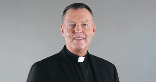 Fr. Dave Caron in a priestly collar.