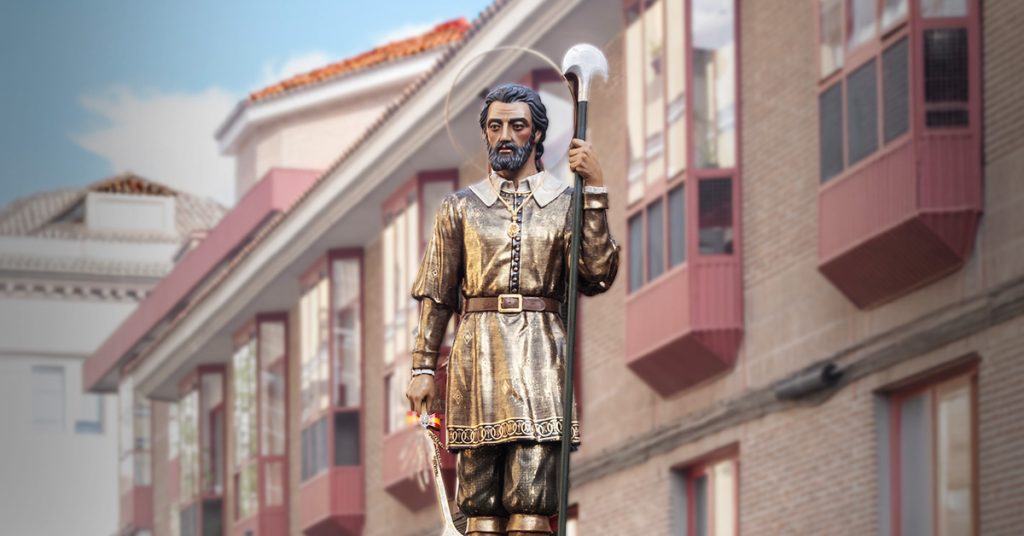 A statue of St. Isidore the Farmer processes through the streets of Spain.