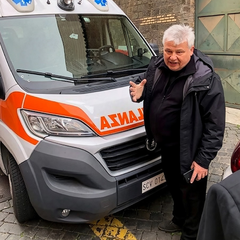 Cardinal Krajewski with an ambulance that will be delivered to our ministry partners.