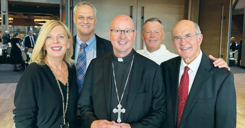 Cross Catholic Outreach President Michele Sagarino, Archbishop Golka, and Cross Catholic Outreach CEO and Co-Founder Jim Cavnar, (back row, left to right) Associate Director of Clergy and Diocesan Relations Shannon Burns and Father David Caron, O.P.